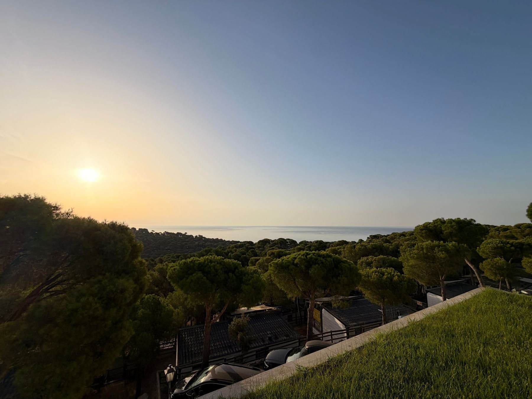 Sunset over pine trees and the sea on the Costa Brava